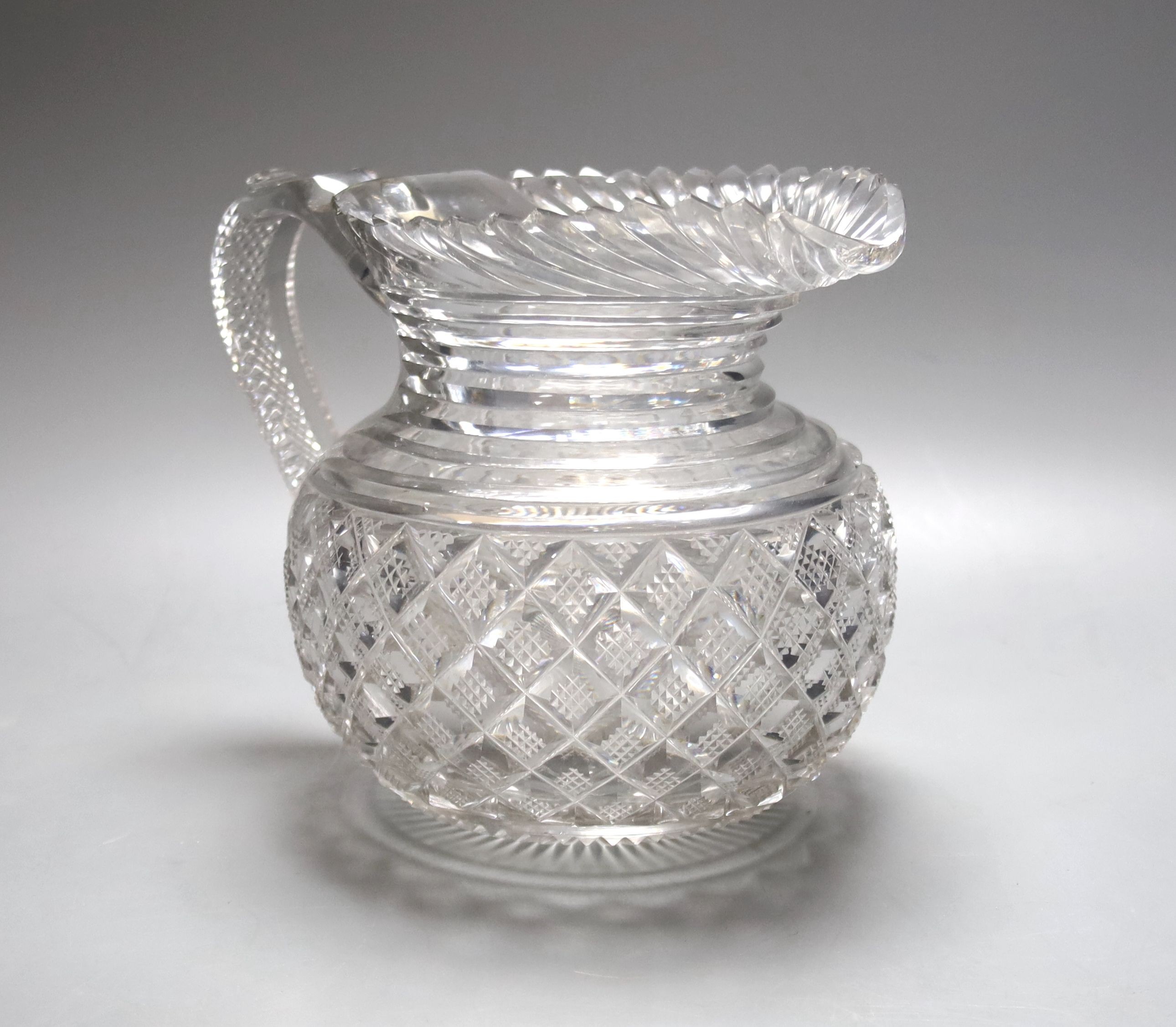A Regency Irish Waterford crystal jug 16cm, crack to base of handle